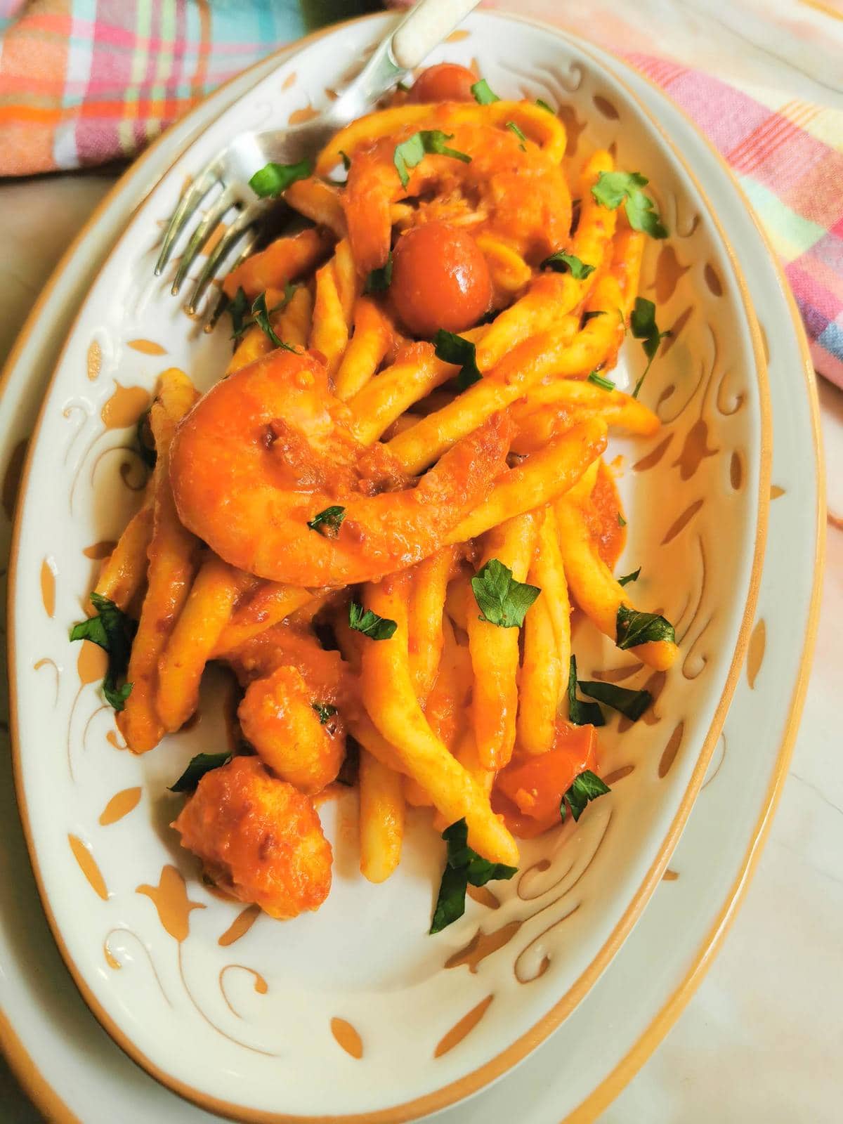 Spicy pasta with nduja sauce and shrimp.