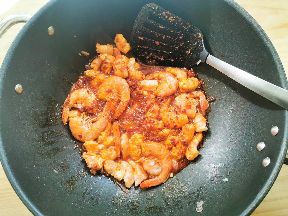 Nduja melted in skillet with shrimp and onion.