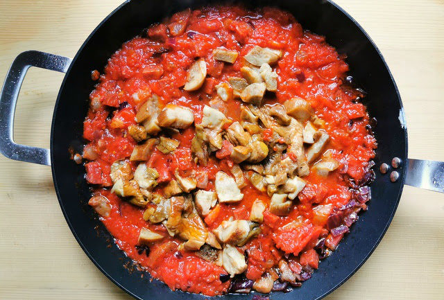 porcini mushrooms added to alla Silana sauce in skillet