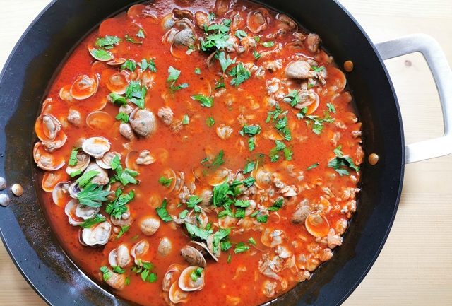 clam and tomato sauce cooking in skillet