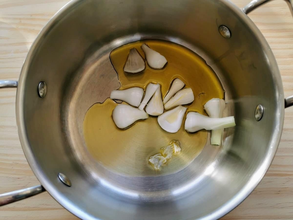 chopped spring onion in pan with olive oil