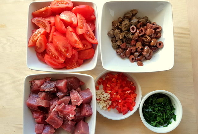 ingredients fo fresh tuna pasta all'eoliana chopped in white bowls