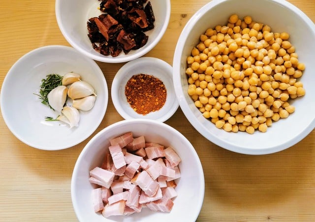 chickpea broth ingredients chopped and prepared in white bowls