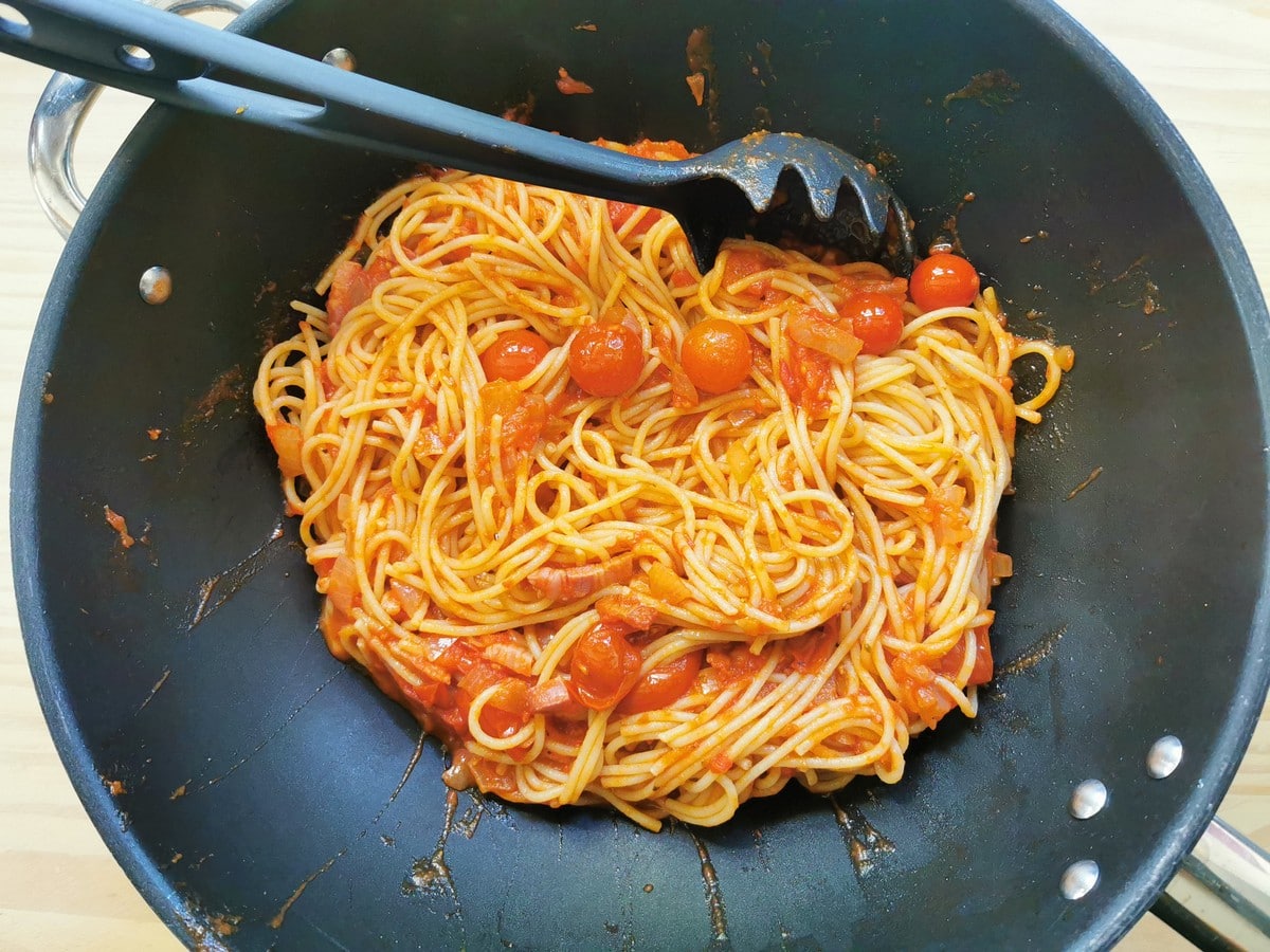 Cooked gluten free spaghetti mixed with the col rancetto sauce in large skillet.