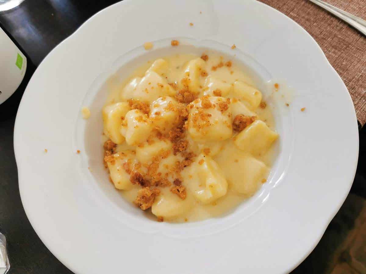 A dish of gnocchi al Castelmagno in a restaurant in Alba, Piemonte.