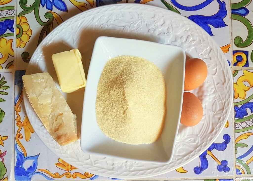 ingredients for gnocchi alla Romana on white plate