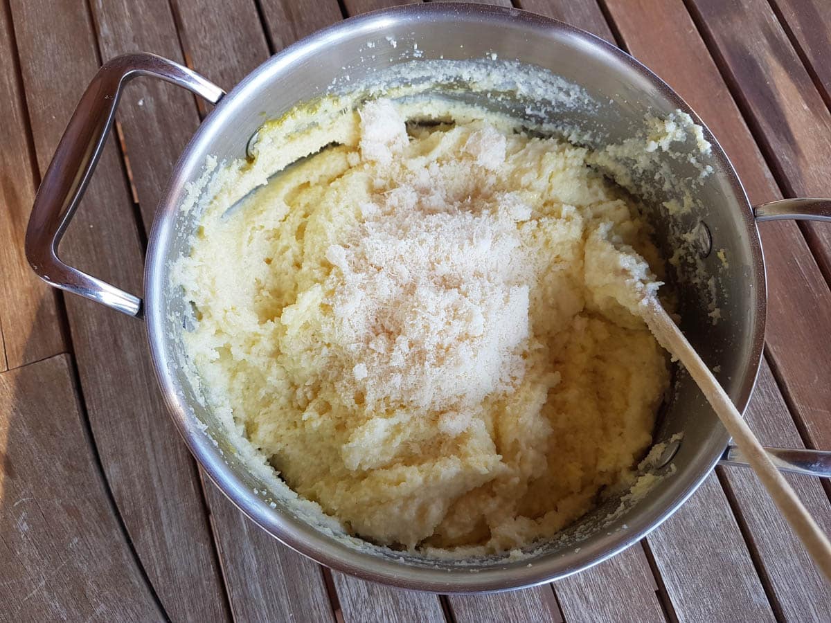 Adding Parmigiano Reggiano to the semolina dough