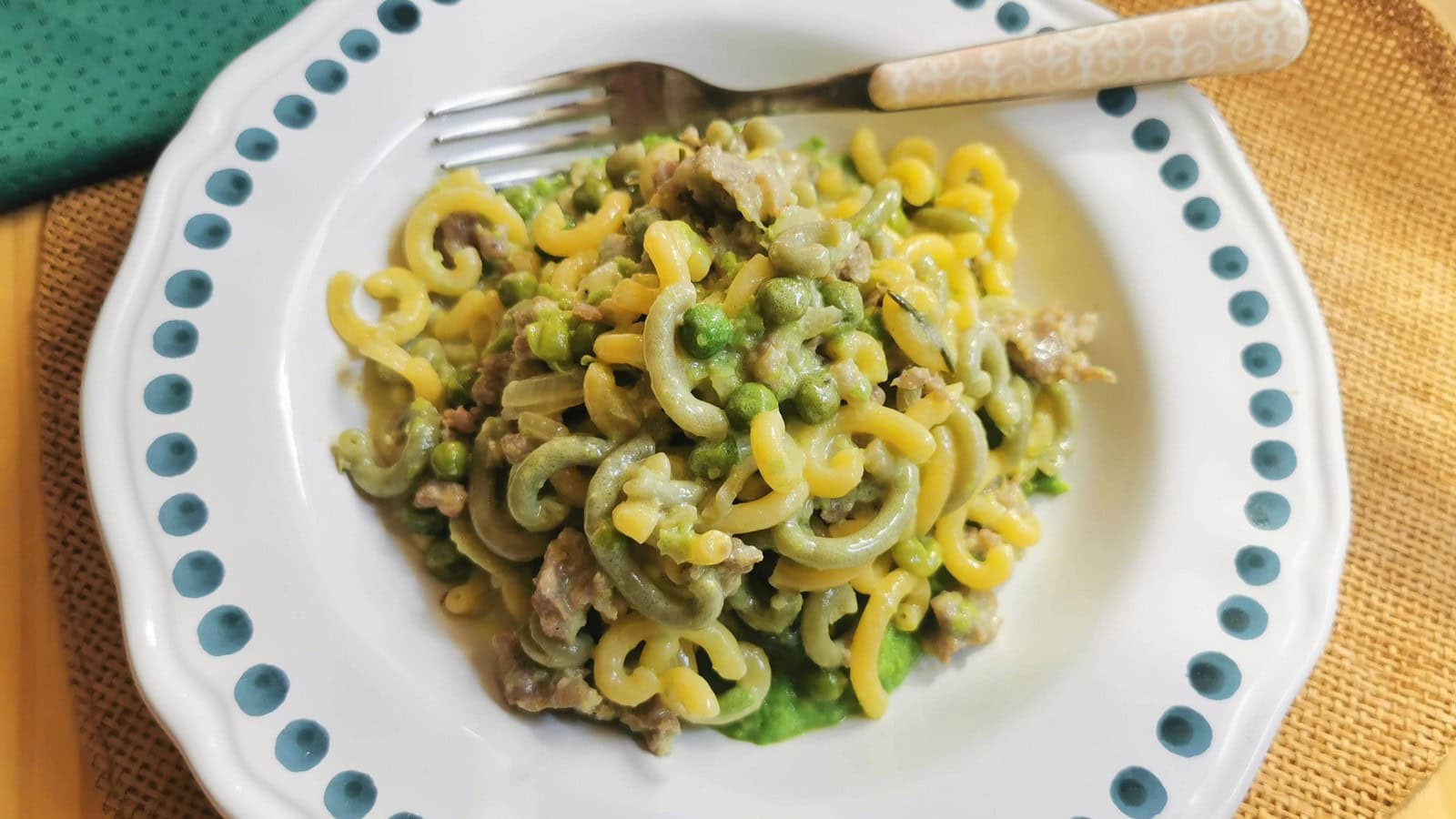 Gramigna pasta with Italian sausage, cream and peas.