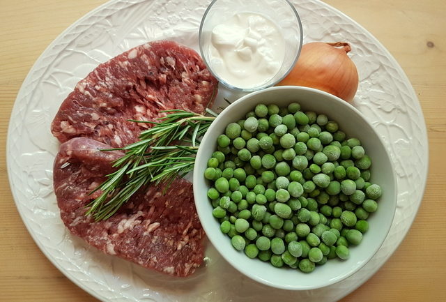 ingredients for gramigna with sausage, peas and cream.