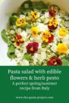 Green pasta salad with edible flowers