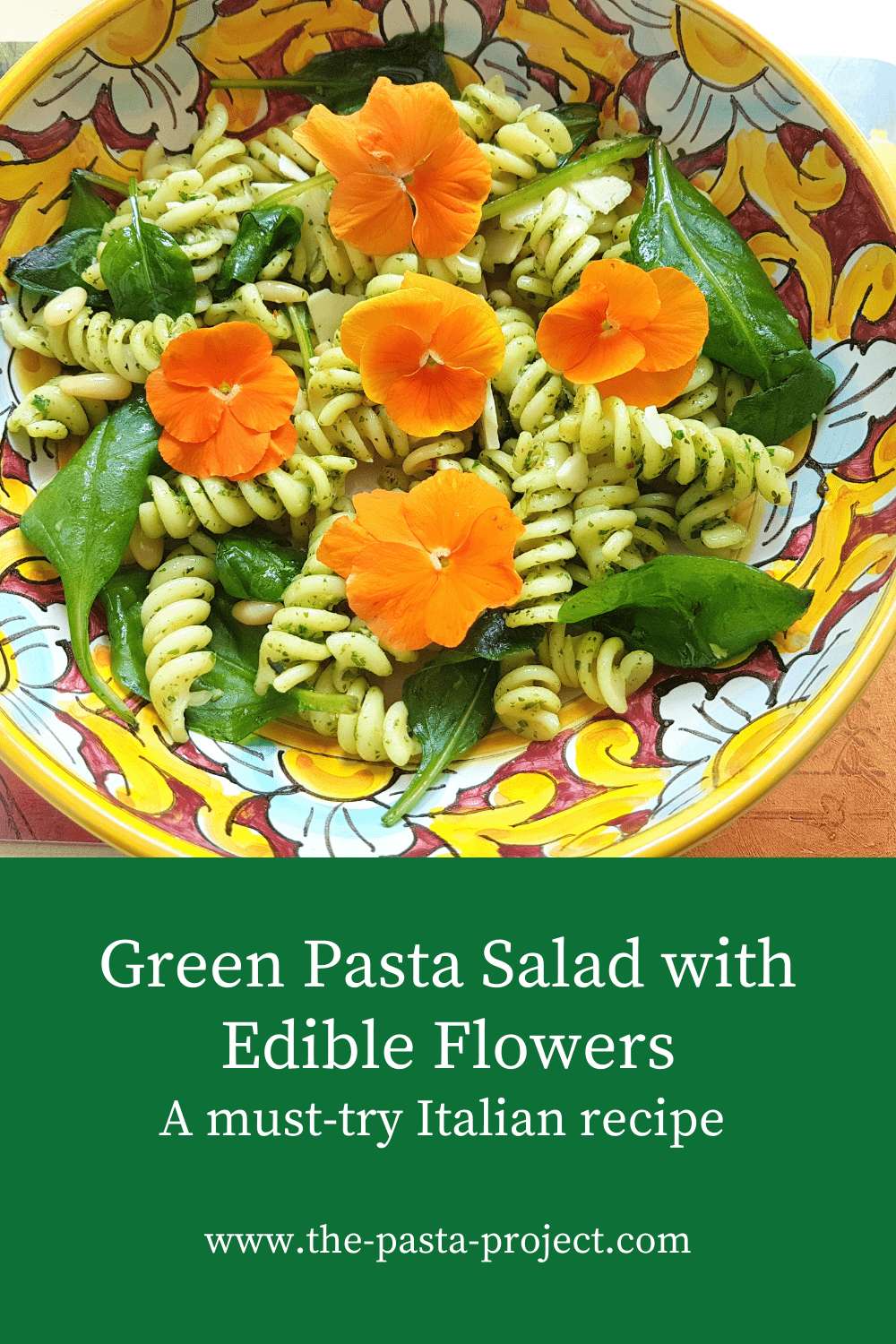 Green pasta salad with edible flowers