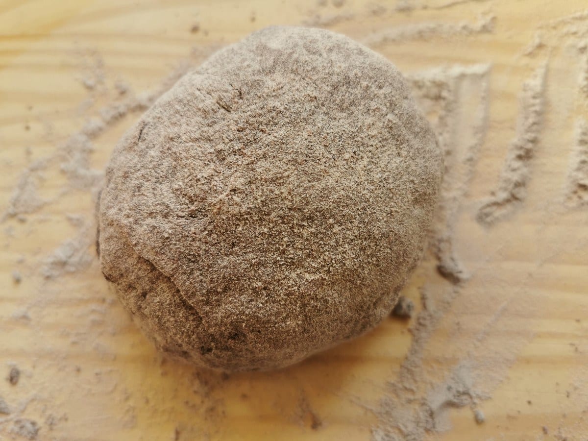 Chocolate ravioli dough rolled into a large ball.