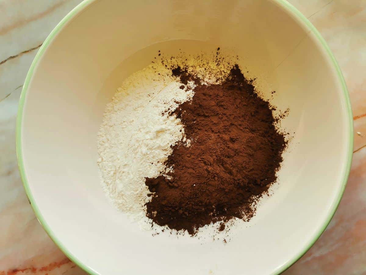Soft wheat flour and cocoa powder in large bowl.