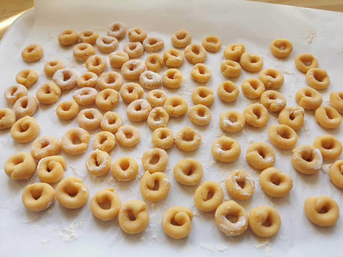 homemade anellini pasta rings on kitchen paper.