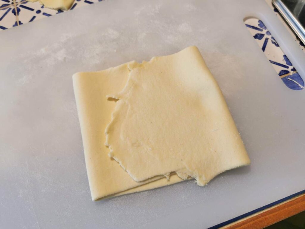 pasta sheet folded in 3 on white board