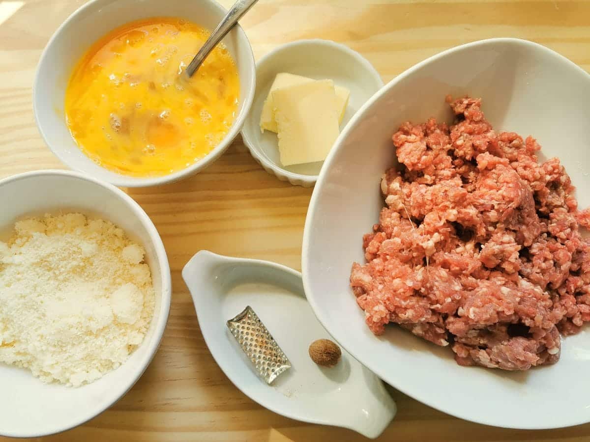 ingredients for cannelloni filling on wood worktop