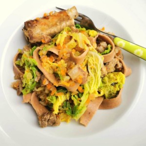 Homemade chestnut pasta with pork and cabbage