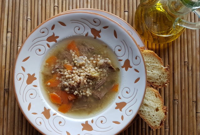 Homemade beef broth with whole-wheat grattoni pasta.