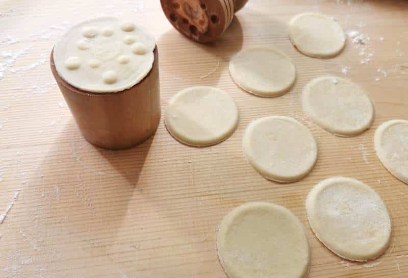 homemade corzetti pasta made with special wooden stamp