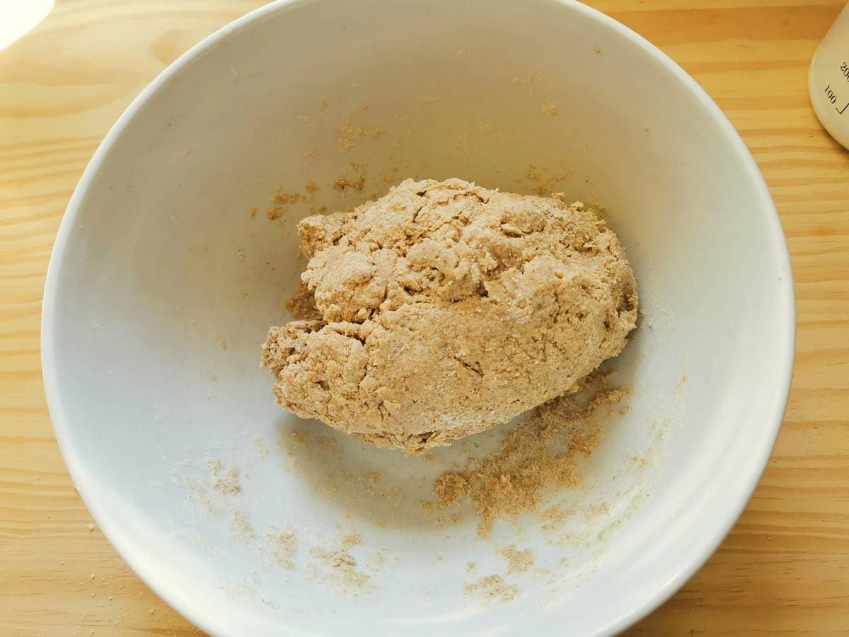 Rye flour dough in white bowl.