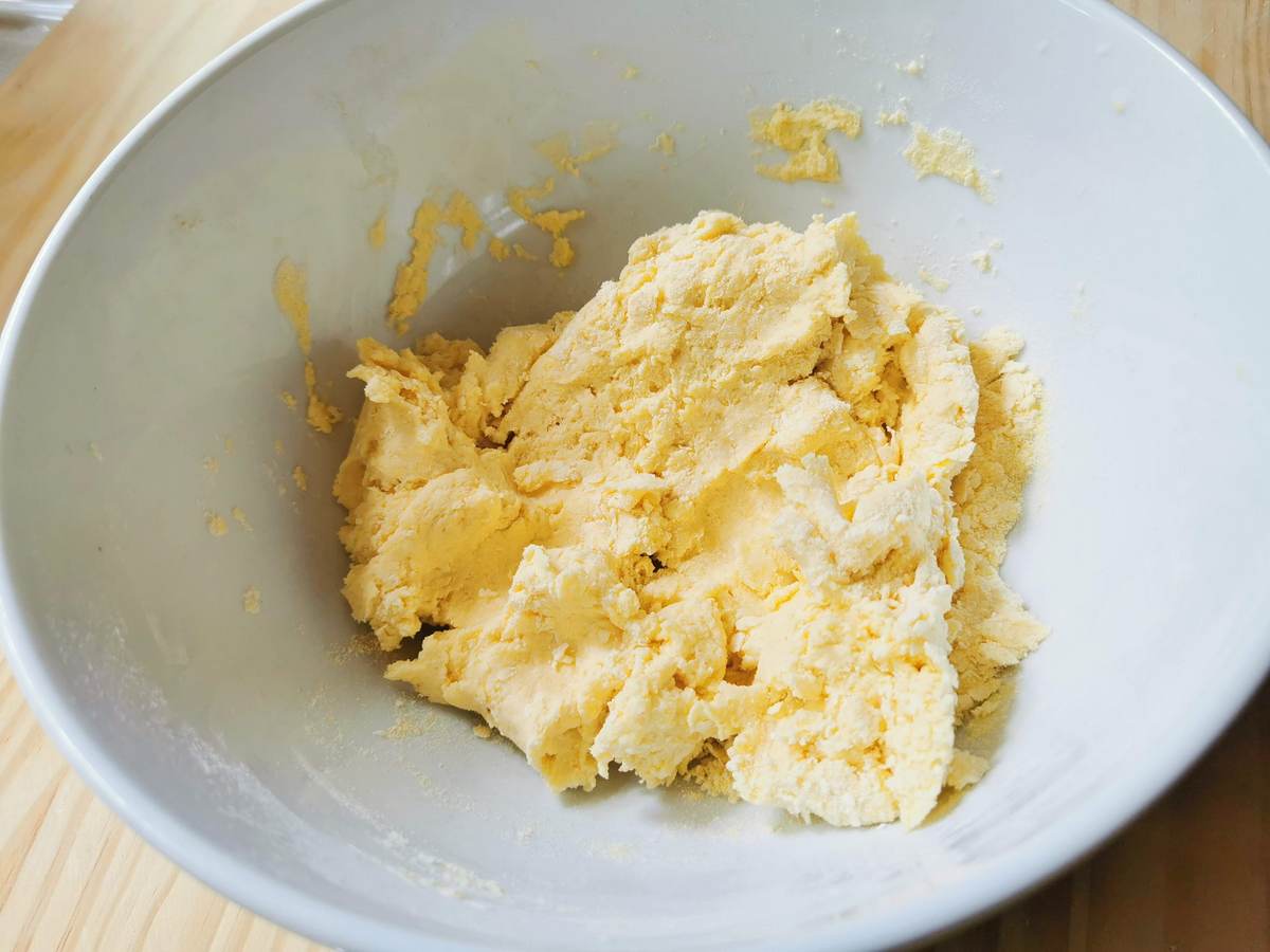 corn and wheat flour dough in white bowl.