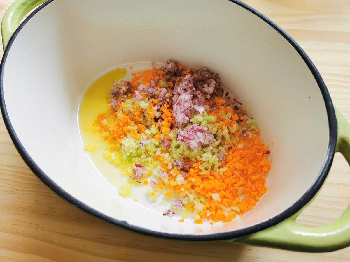 finely chopped onions, carrots and celery with olive oil in Dutch oven.