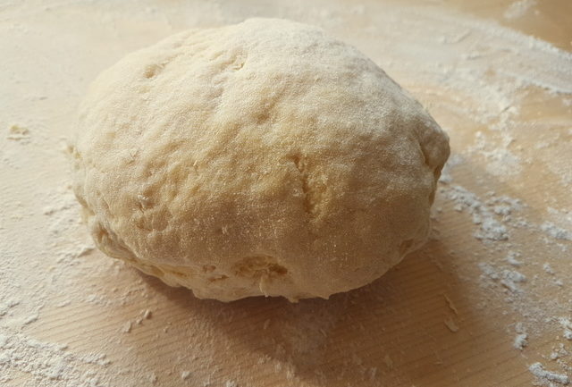 pasta dough on wooden board