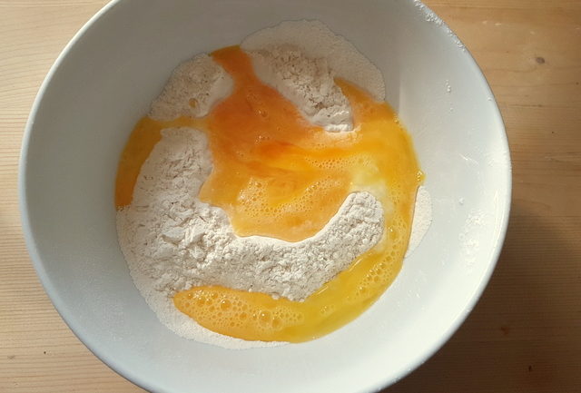 eggs and flour in white bowl