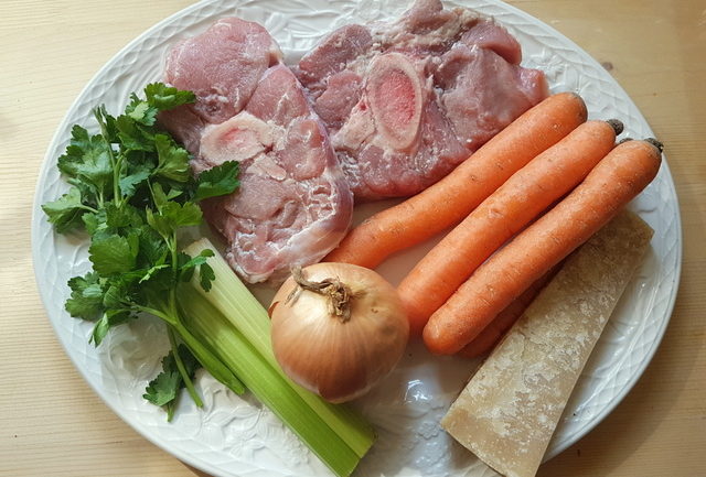 ingredients for osso buco broth on white plate