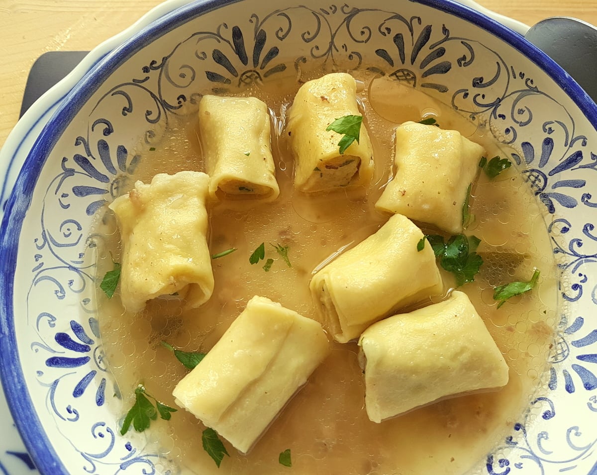 Homemade stuffed mezze maniche in broth a traditional pasta recipe for Lent.