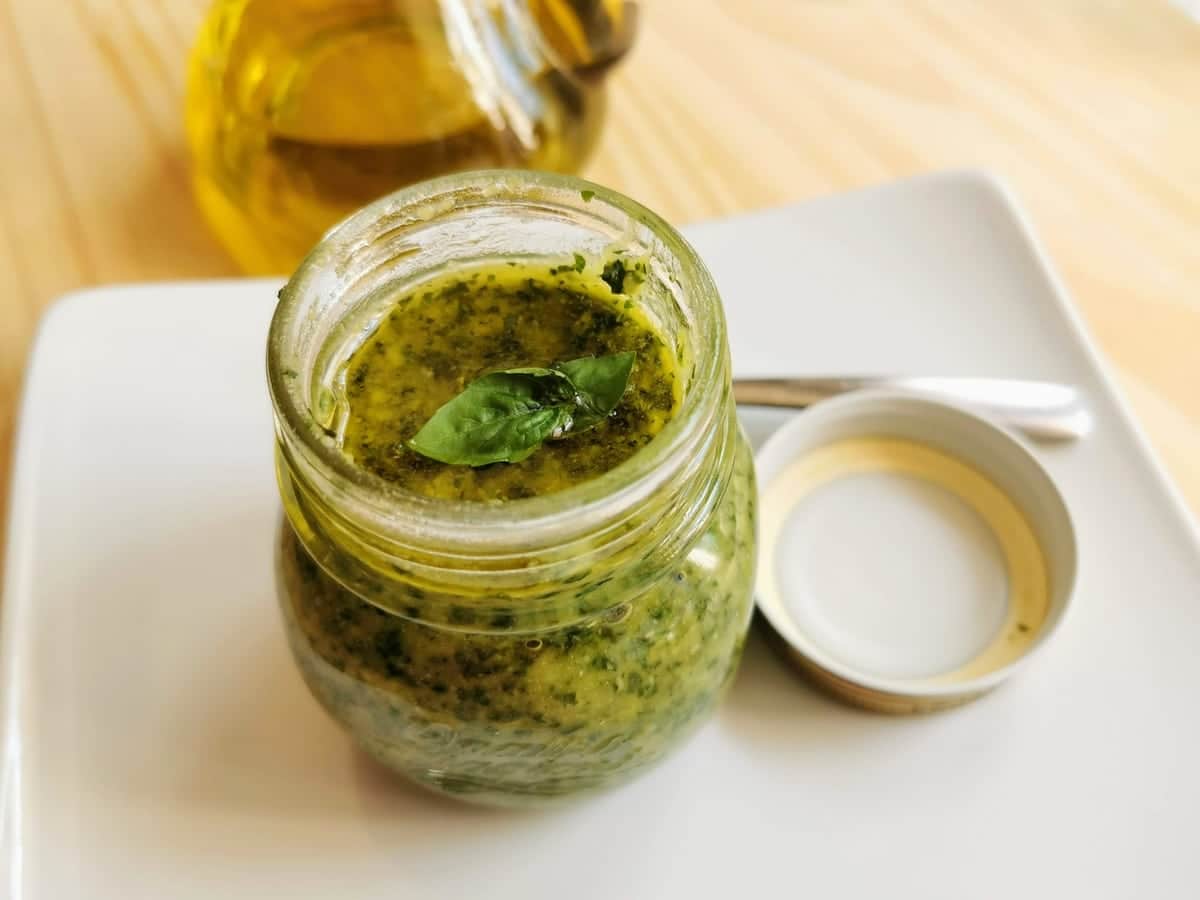 homemade basil pesto genovese in small mason jar