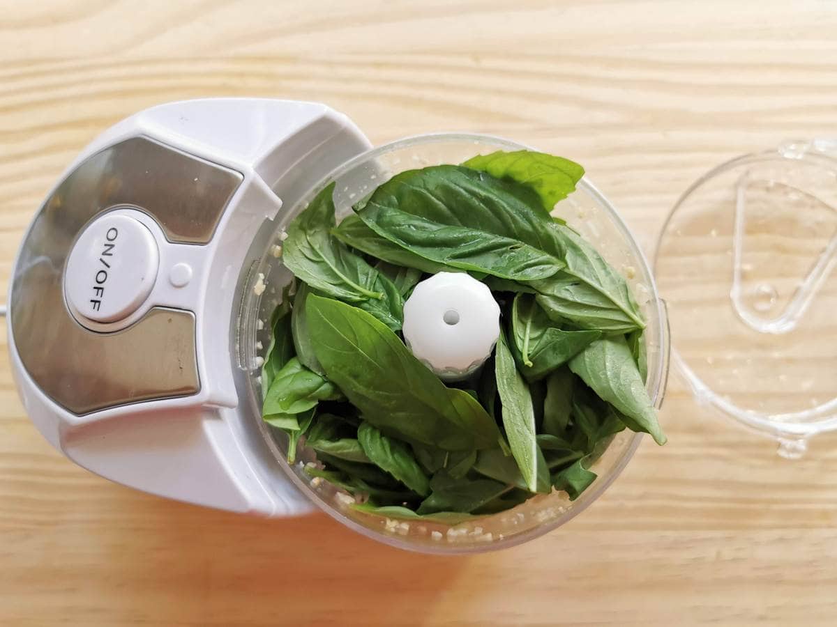 whole basil leaves in food processor