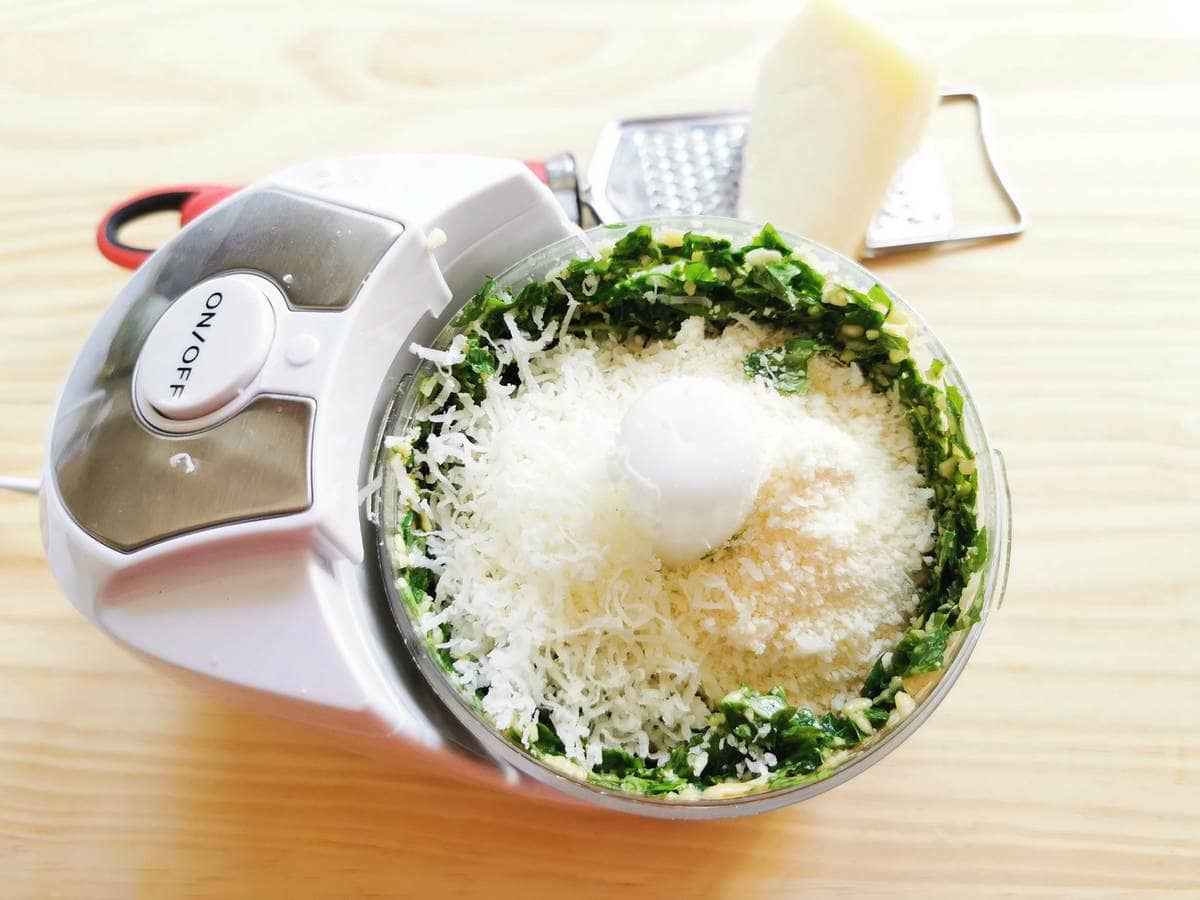 grated parmigiano and pecorino sardo in food processor with minced basil, garlic and pine nuts