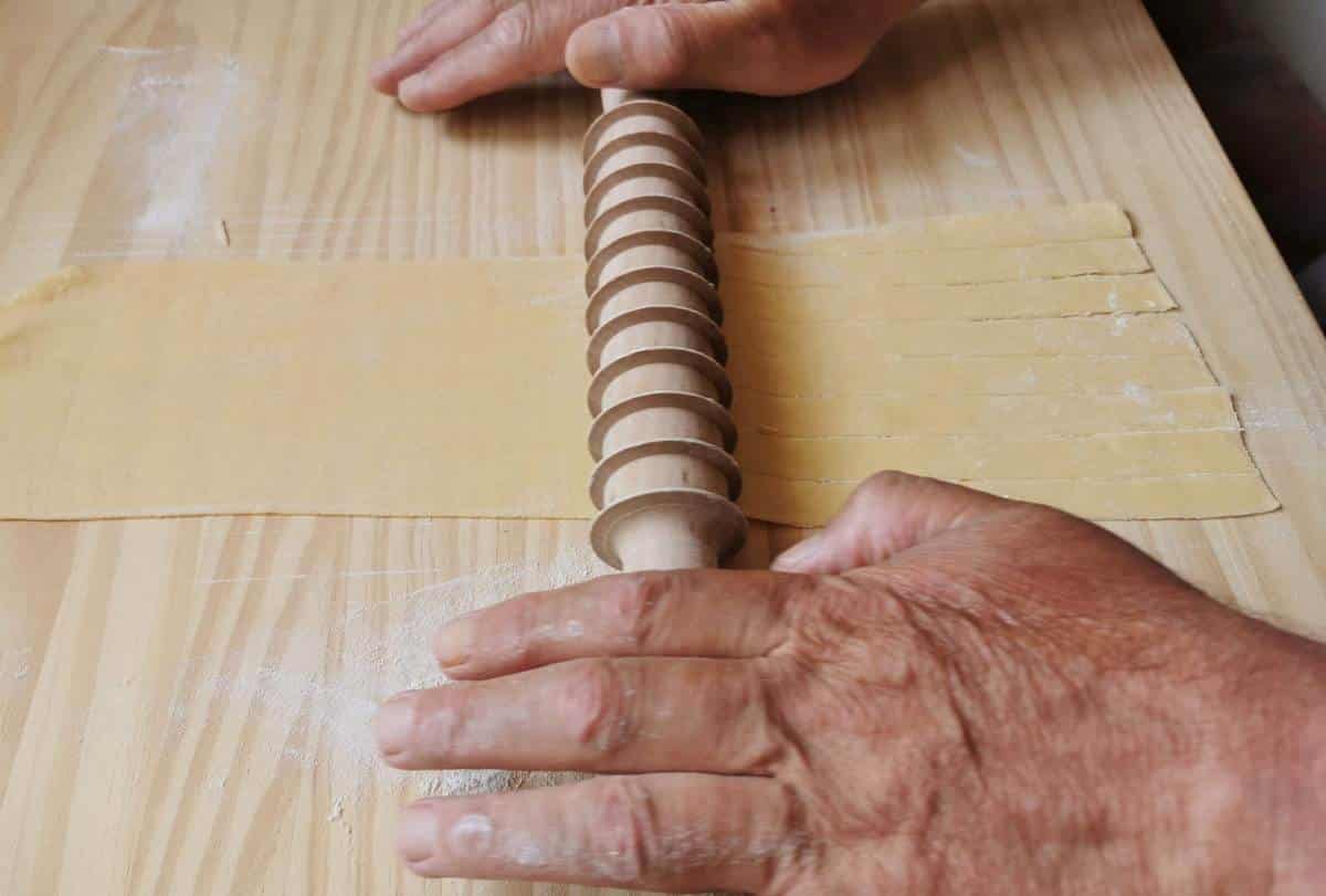 Using a pasta cutting rolling pin on a plain pasta sheet.