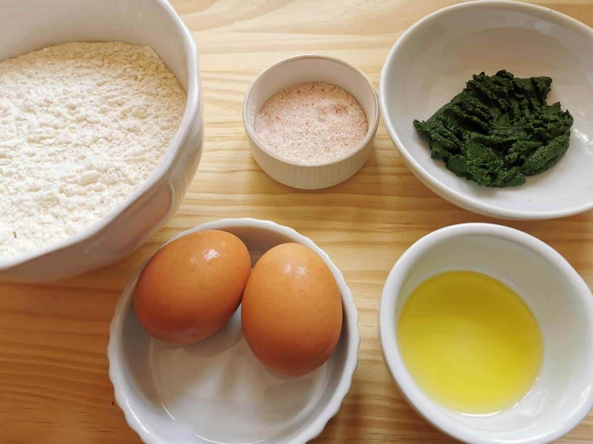 Ingredients for green colored egg pasta made with spinach purée.