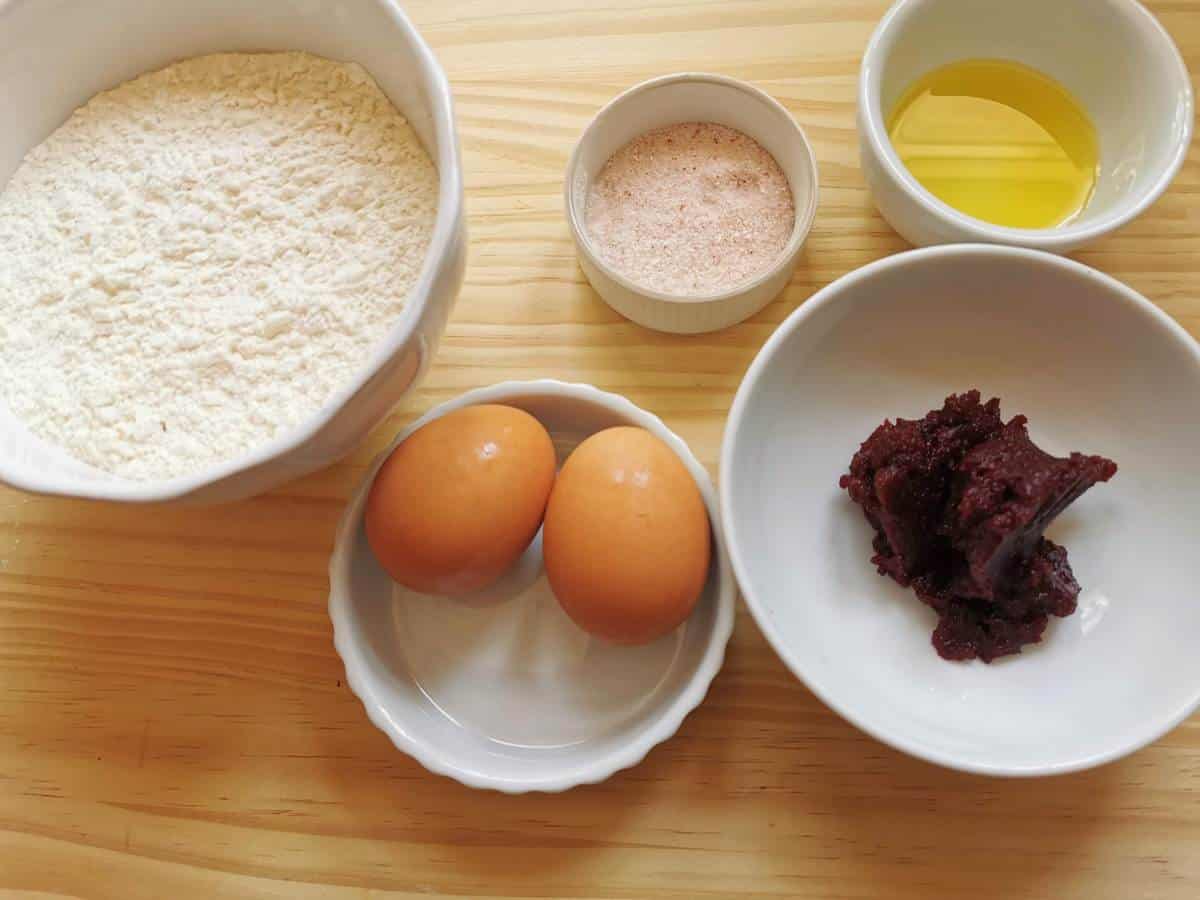 Ingredients for red colored pasta made with beetroot puréè.