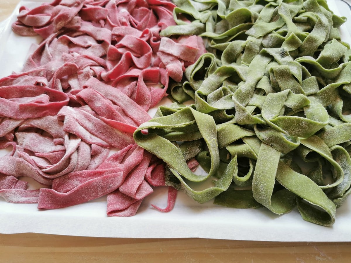 Red and green homemade pasta ribbons.