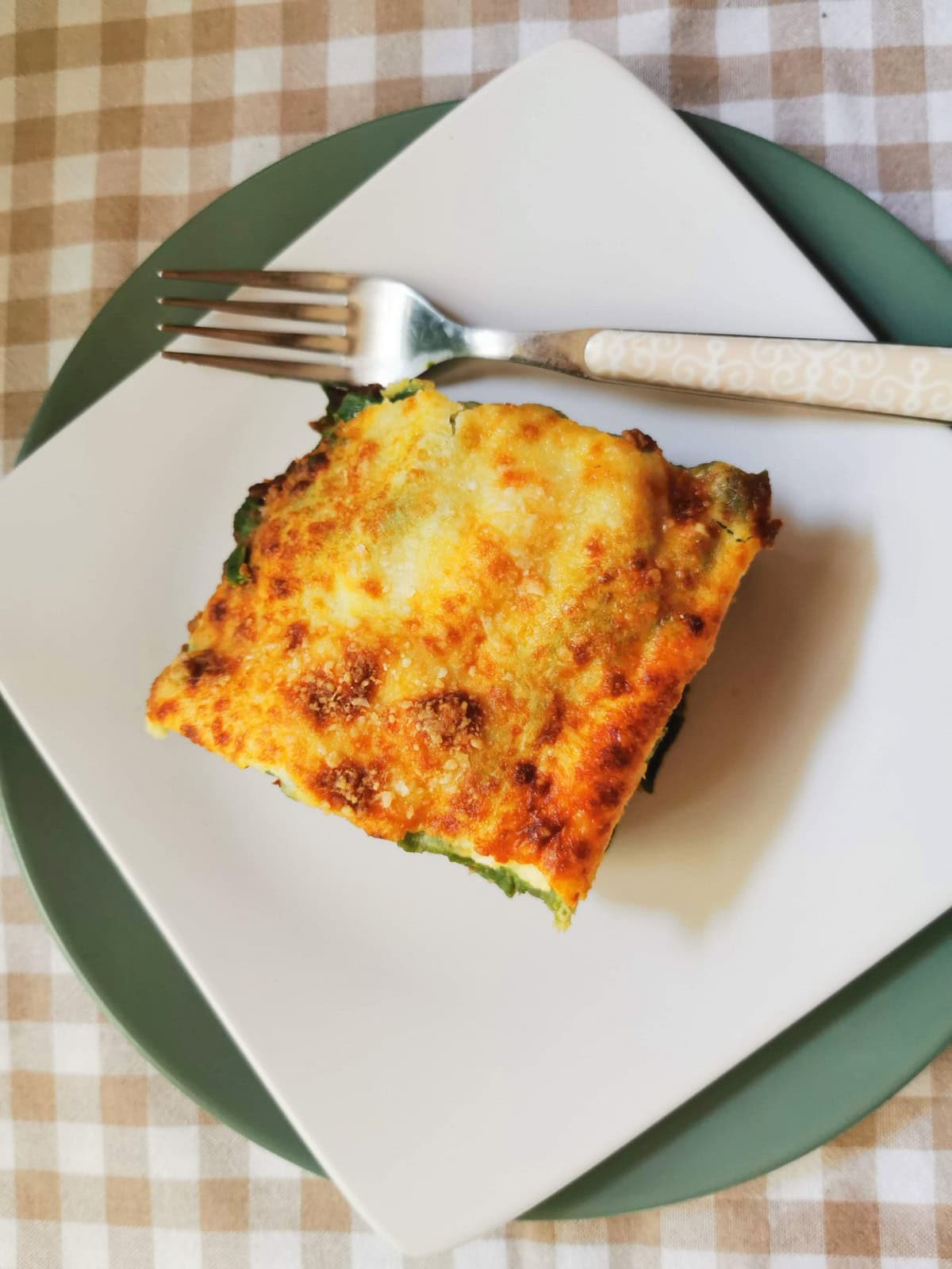 Serving of lasagne al forno (lasagna) with bolognese sauce.