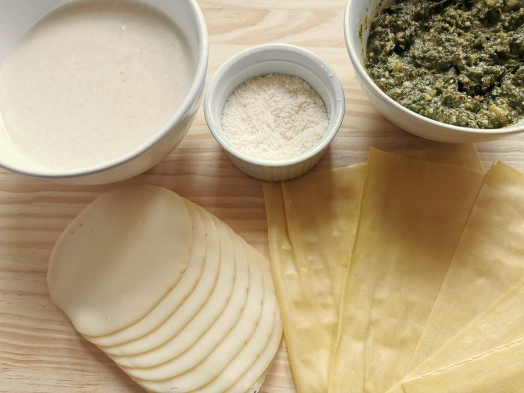 ingredients for pesto lasagna on wooden board