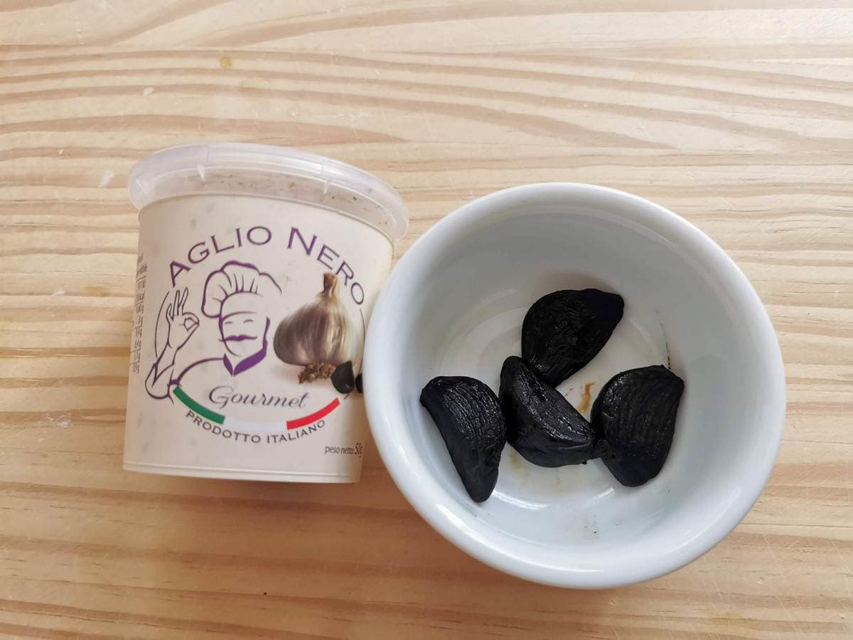 Black garlic cloves produced in Italy.