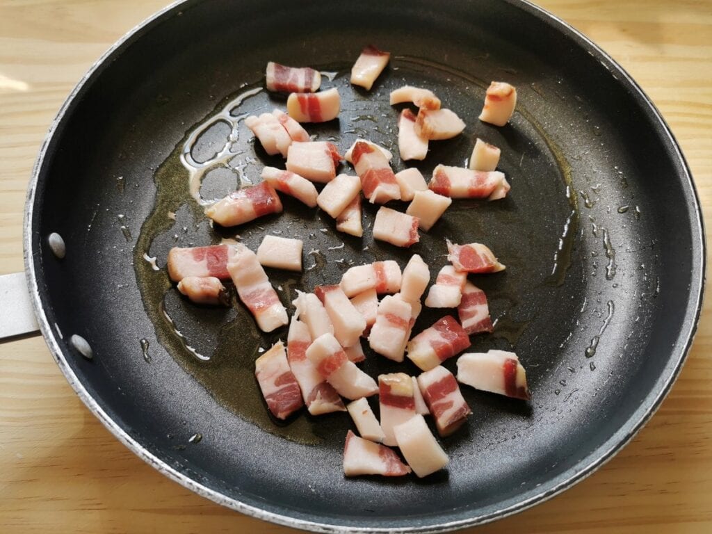 cubes of guanciale in skillet with olive oil