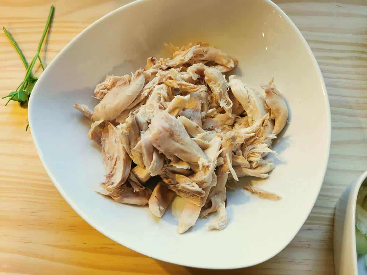 Chicken meat in white bowl