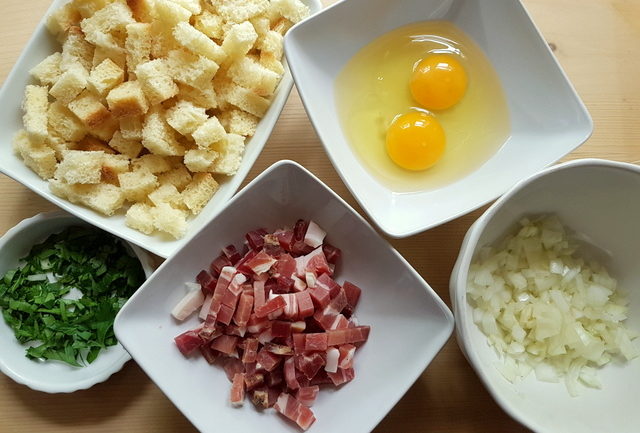 prepared ingredients for Italian dumplings in white bowls