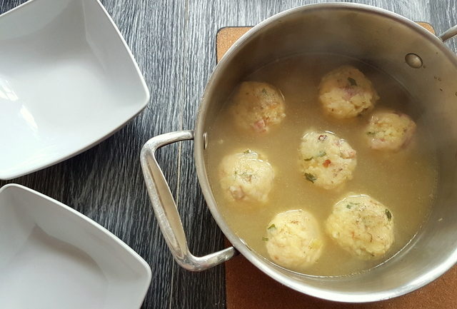 ready to serve canederli in broth in saucepan