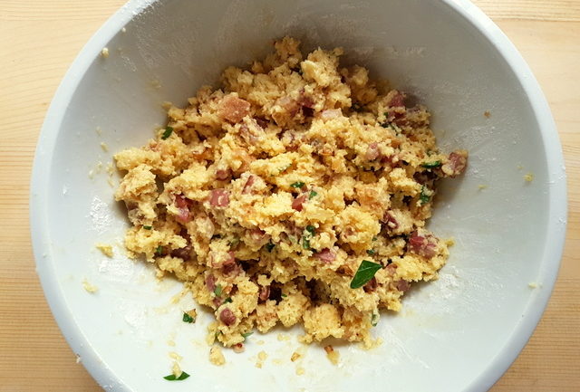 ingredients for canederli mixed together in white bowl