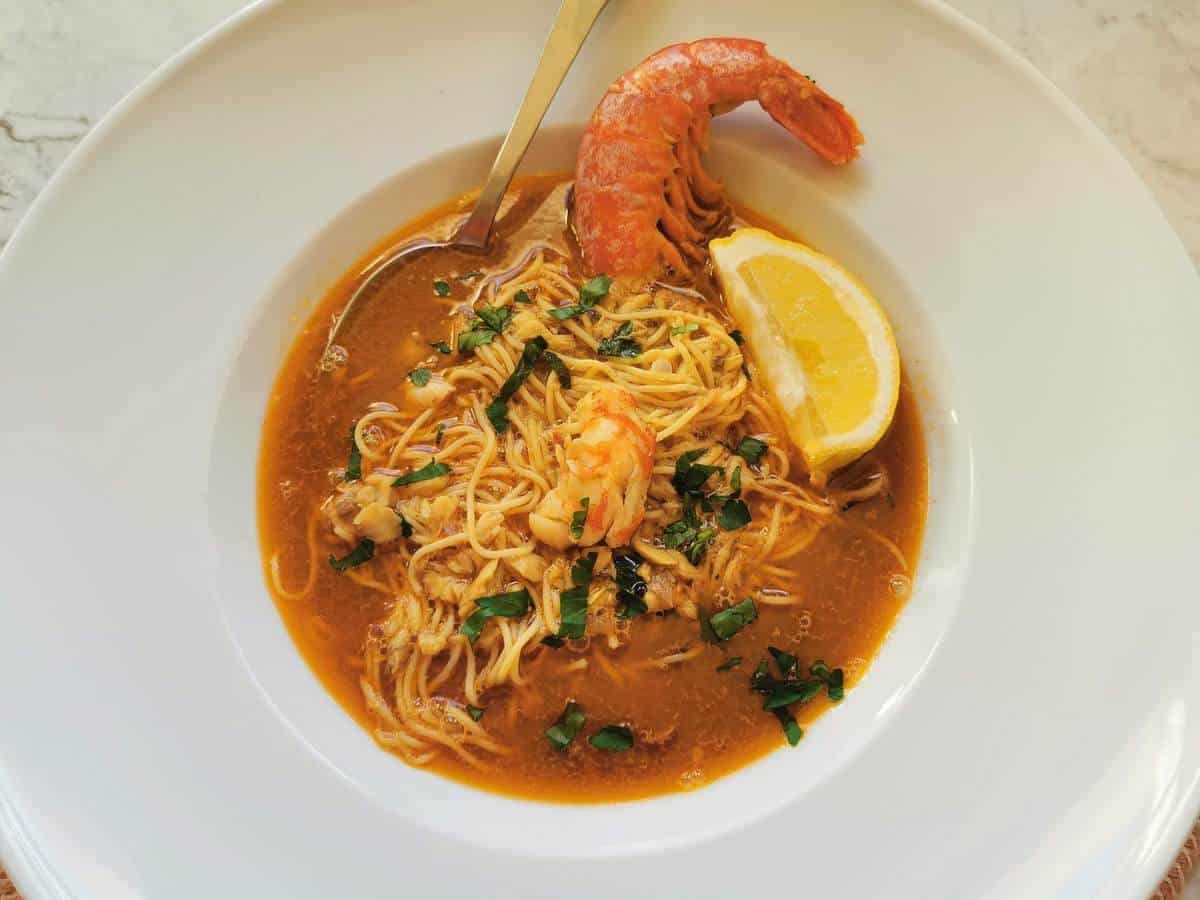 Italian fish soup with angel hair pasta and prawns.