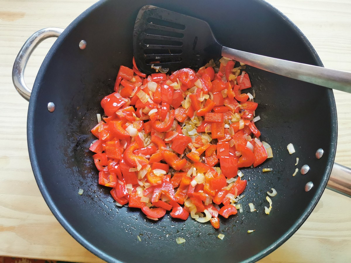 Sautéed onion and sweet red pepper in large skillet.