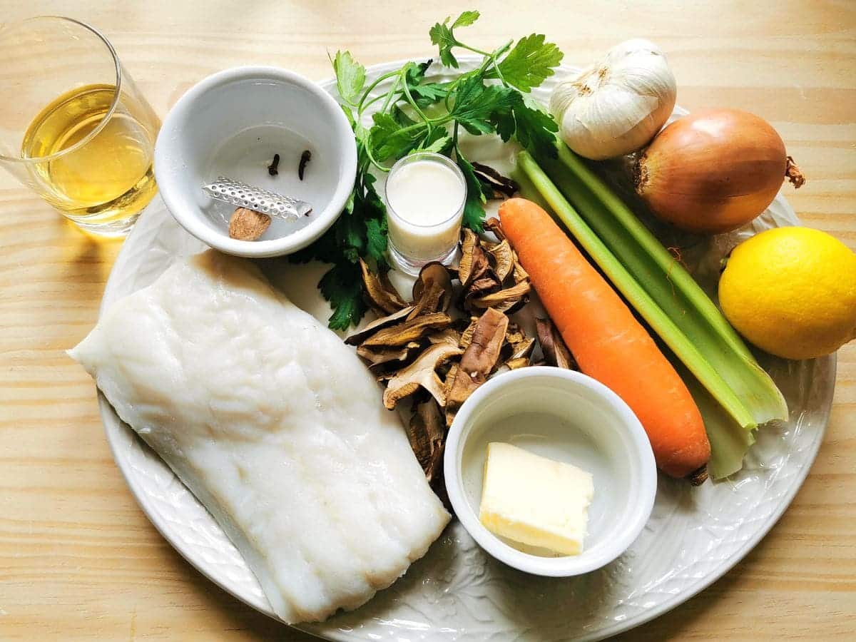 ingredients for Italian salt cod and porcini tagliatelle on white plate