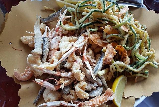 deep fried seafood in restaurant in Le Marche region