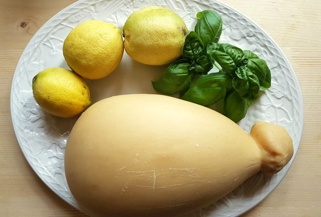 lemon water spaghetti recipe ingredients on white plate
